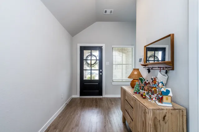 wooden floor in a livingroom with an empty room and wooden floor