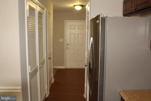 a view of a hallway with a wooden floor