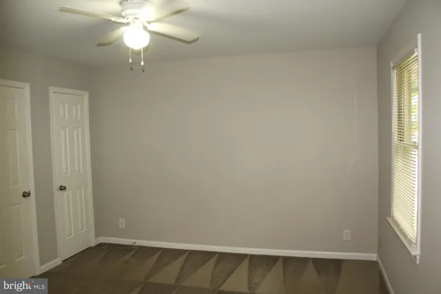 an empty room with wooden floor