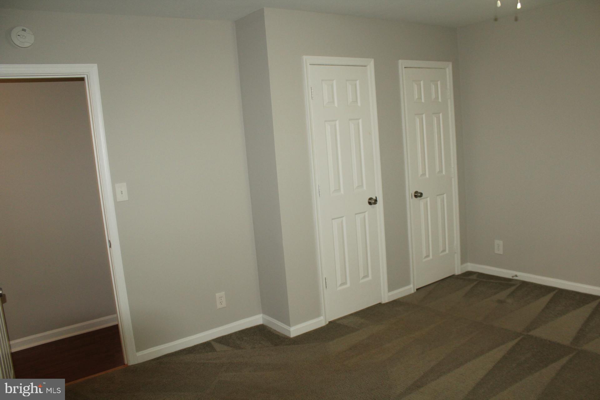 423 Laurel Avenue Fredericksburg, VA 22408 - Photo 16 of 28 an empty room with wooden floor