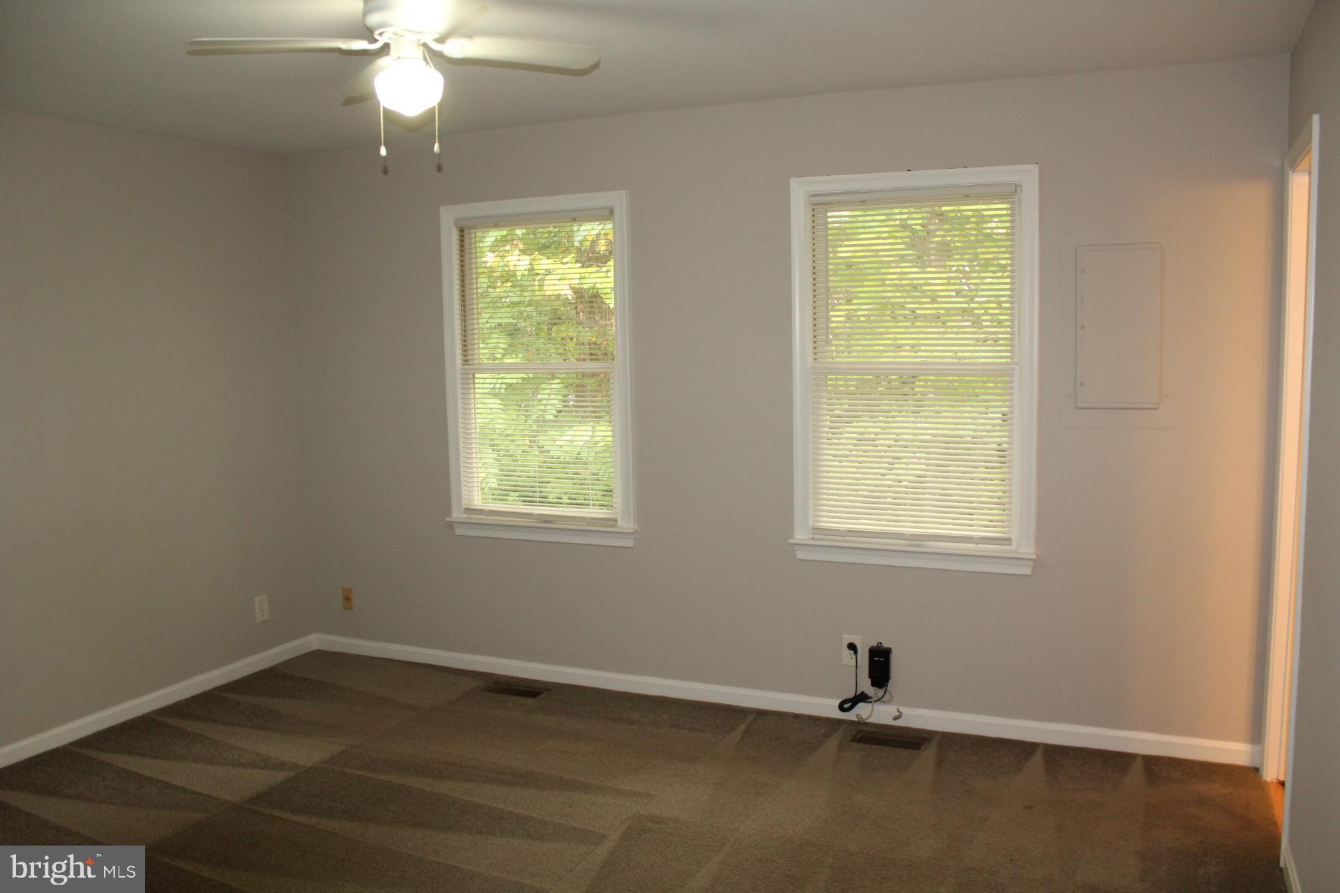 423 Laurel Avenue Fredericksburg, VA 22408 - Photo 18 of 28 an empty room with wooden floor closet and windows