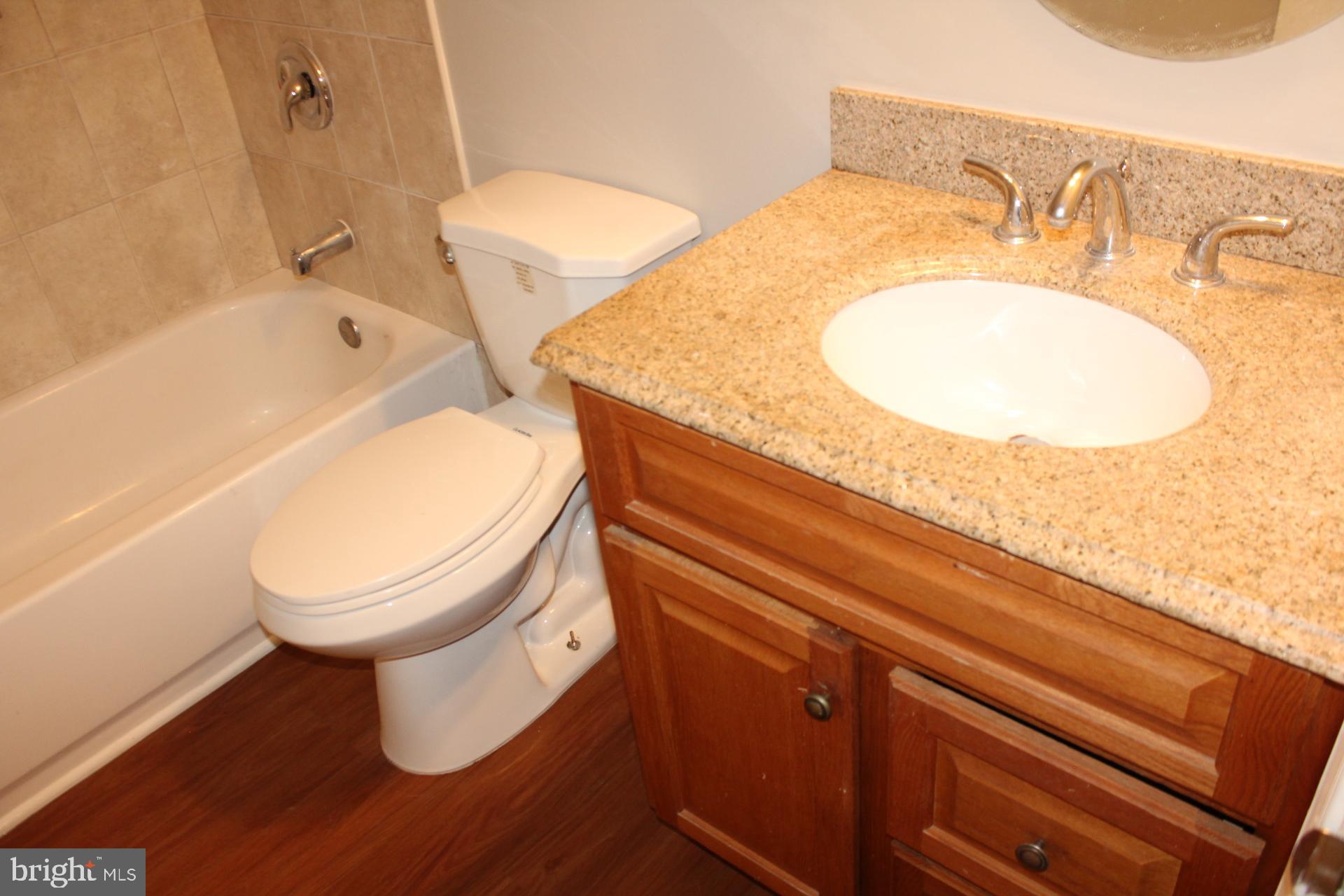 423 Laurel Avenue Fredericksburg, VA 22408 - Photo 19 of 28 a bathroom with a sink and a mirror