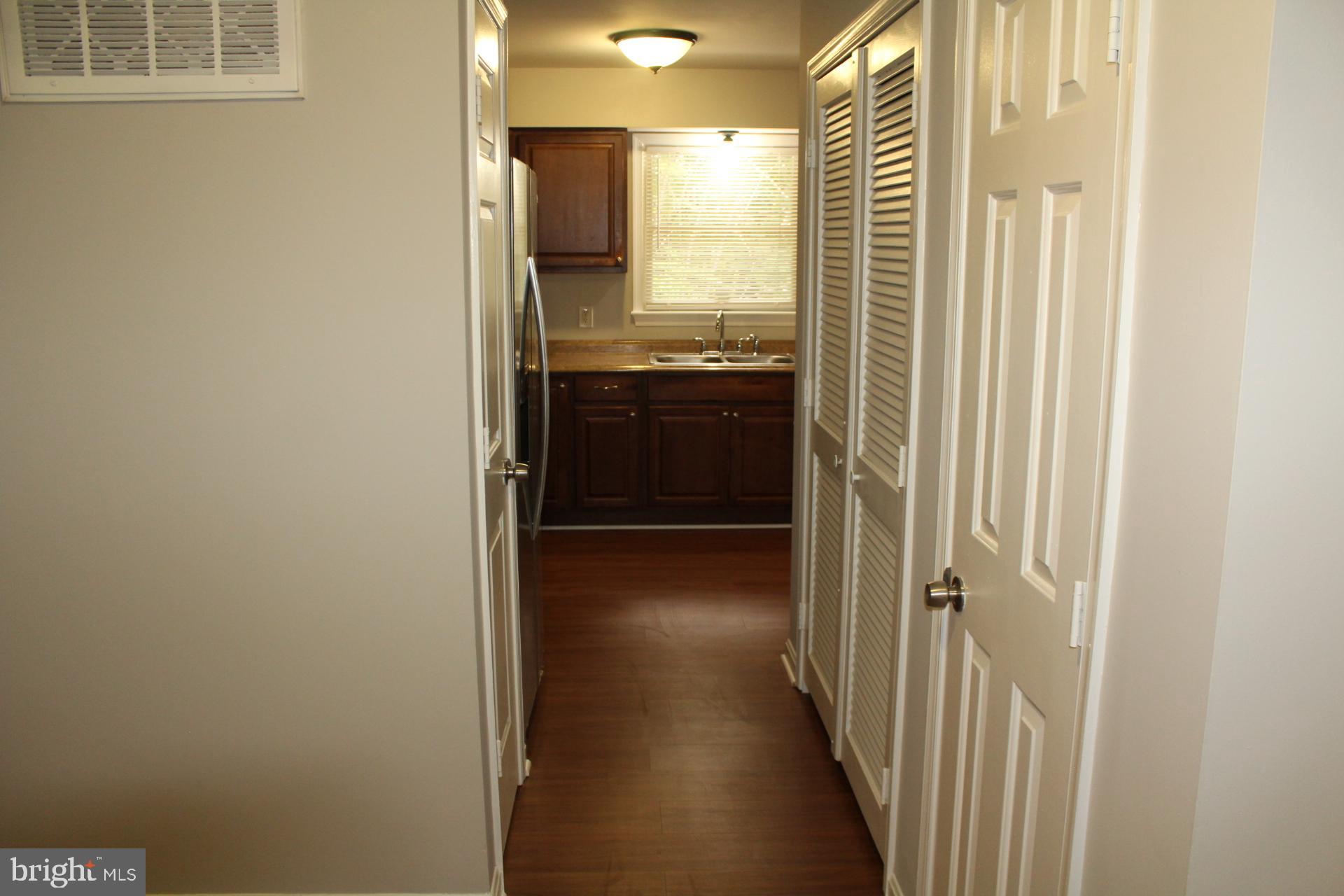 423 Laurel Avenue Fredericksburg, VA 22408 - Photo 3 of 28 a view of a kitchen from a hallway