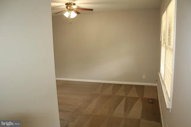 a view of an empty room and window