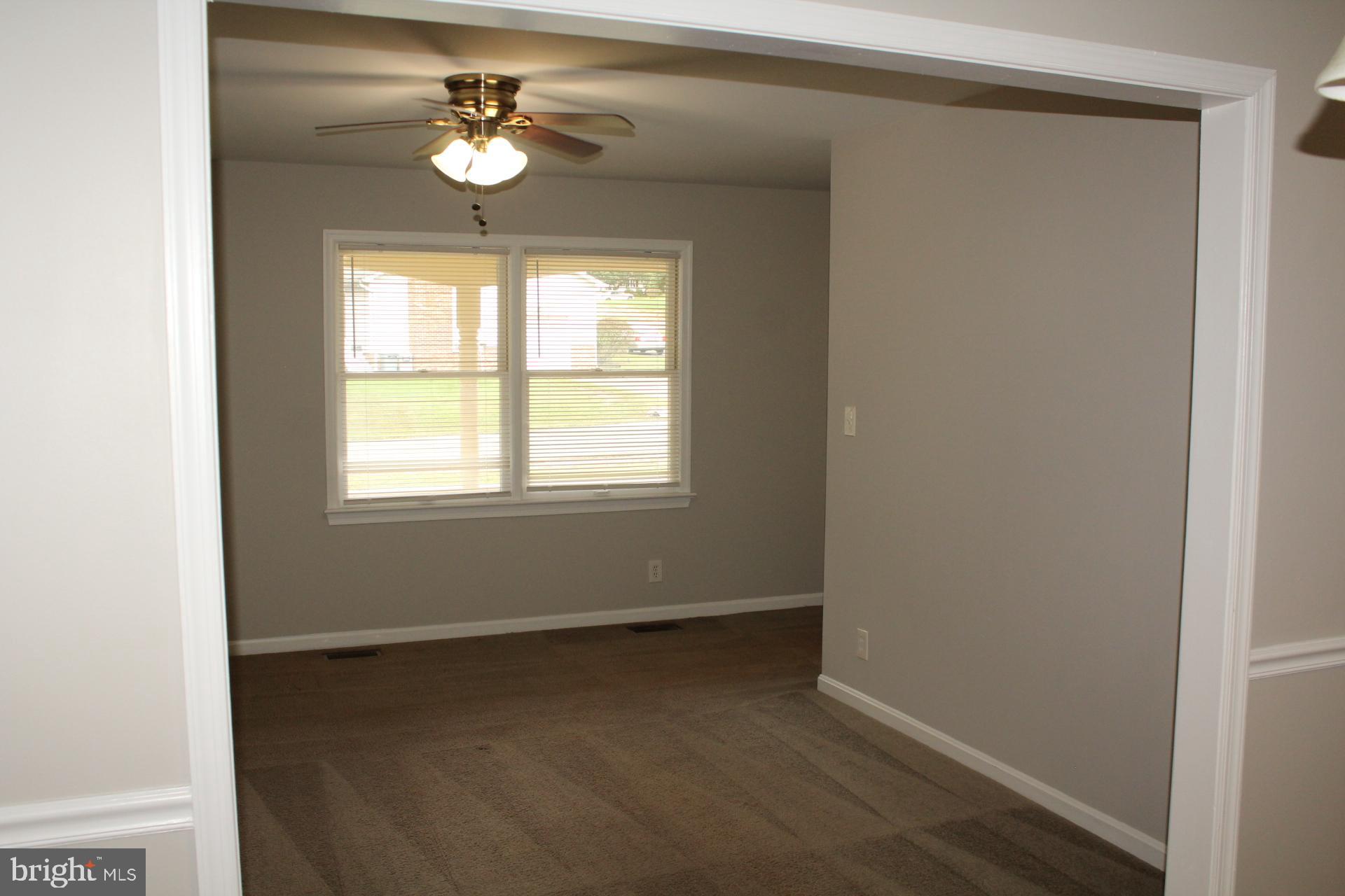 423 Laurel Avenue Fredericksburg, VA 22408 - Photo 5 of 28 a view of an empty room with a window