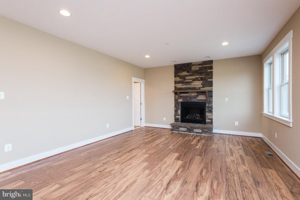 3838 Bullfrog Road Taneytown, MD 21787 - Photo 3 of 28 Family room features lovely stone fireplace.