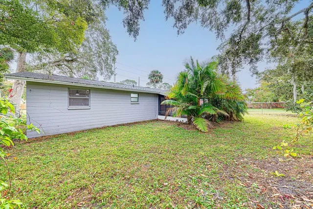 a backyard of a house with lots of green space