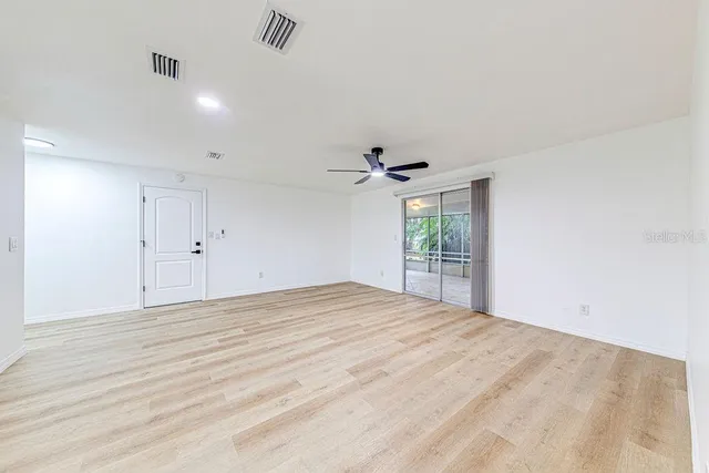 a view of an empty room with a window