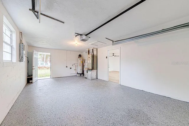 a view of a big room with closet and windows