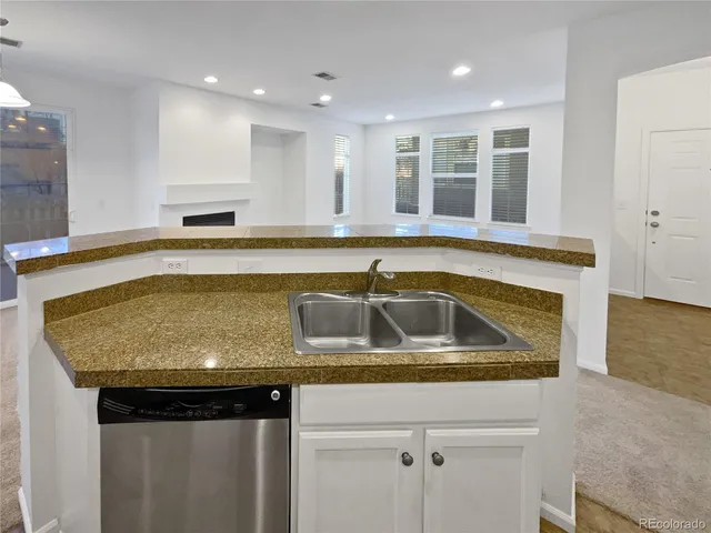 a kitchen with a sink and a window