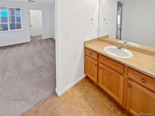 a white bath tub sitting next to a white toilet