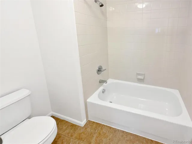 a view of a storage & utility room with a washer dryer