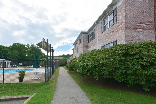 a view of a swimming pool with outdoor seating