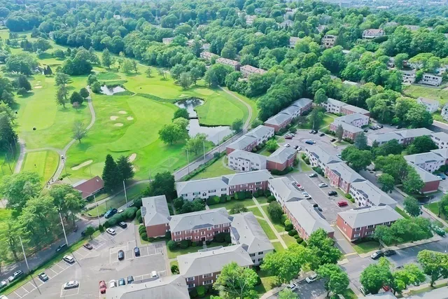 an aerial view of a houses with ocean view