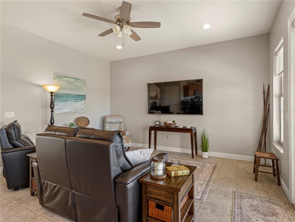 20 Fort Clinch Heights Road Frostproof, FL 33843 - Photo 13 of 38 a living room with furniture and a flat screen tv