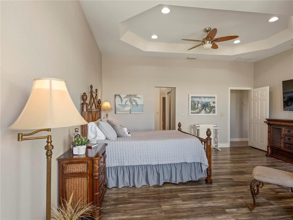 20 Fort Clinch Heights Road Frostproof, FL 33843 - Photo 16 of 38 a bedroom with a bed and wooden floor