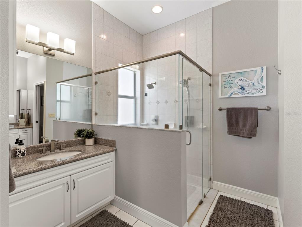 20 Fort Clinch Heights Road Frostproof, FL 33843 - Photo 17 of 38 a bathroom with a shower sink and mirror
