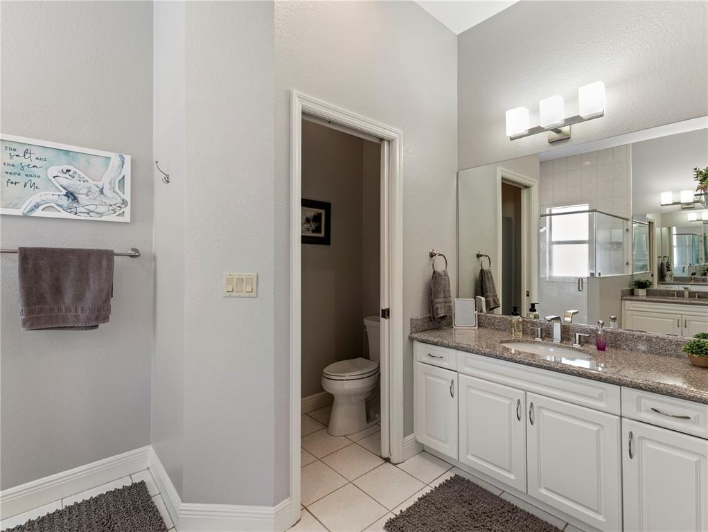 20 Fort Clinch Heights Road Frostproof, FL 33843 - Photo 18 of 38 a spacious bathroom with a toilet sink and mirror