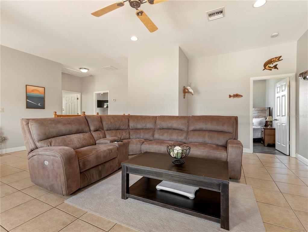 20 Fort Clinch Heights Road Frostproof, FL 33843 - Photo 20 of 38 a living room with furniture and a flat screen tv
