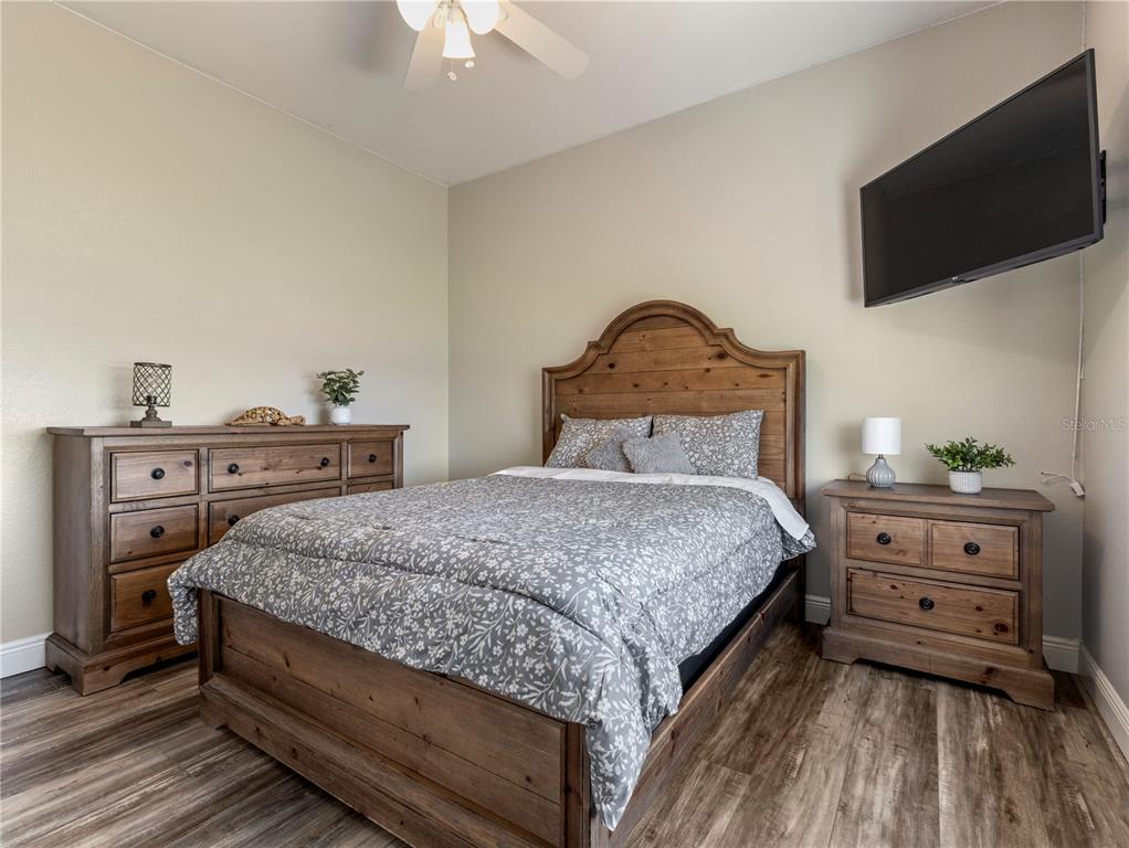 20 Fort Clinch Heights Road Frostproof, FL 33843 - Photo 21 of 38 a bedroom with a bed and a flat screen tv
