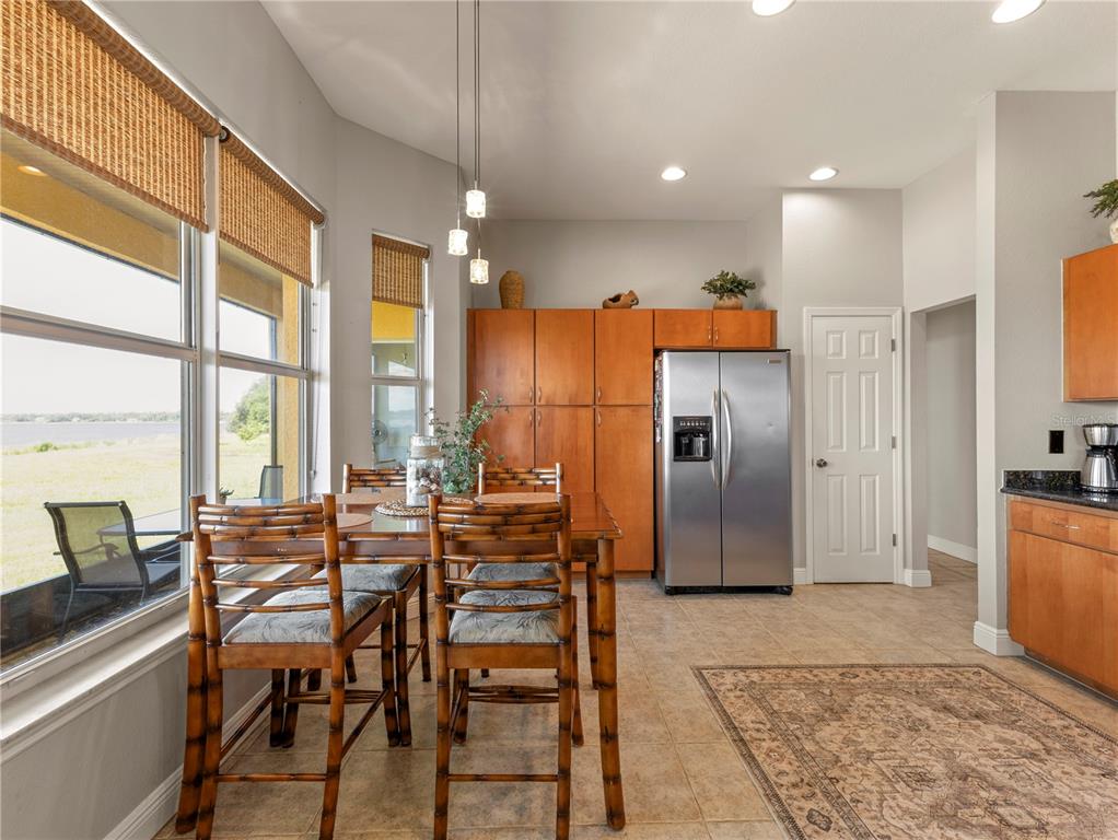 20 Fort Clinch Heights Road Frostproof, FL 33843 - Photo 10 of 38 a view of a kitchen with furniture and large windows