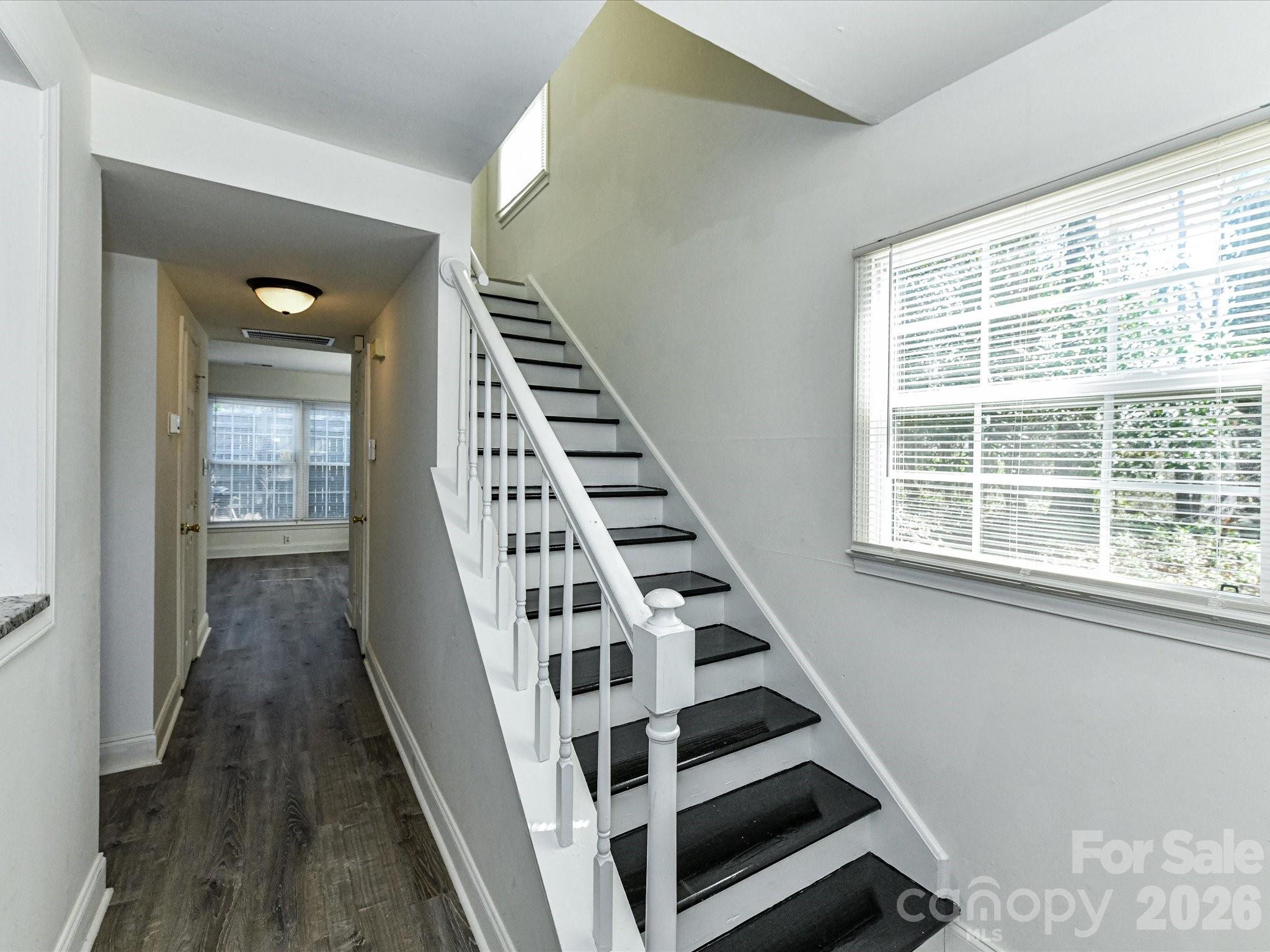8322 Knights Bridge Road Charlotte, NC 28210 - Photo 21 of 37 a view of wooden floor and windows in a room