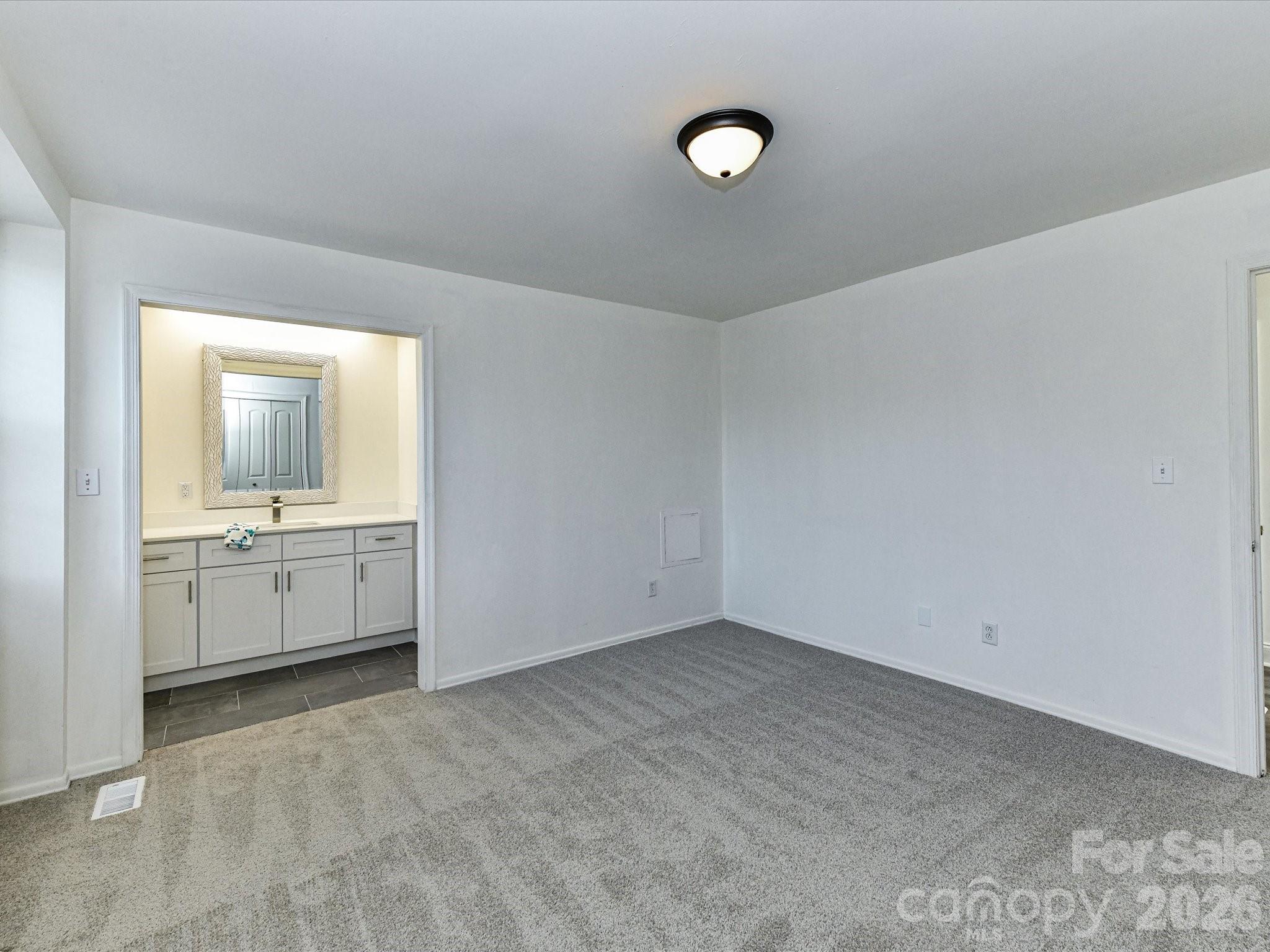 8322 Knights Bridge Road Charlotte, NC 28210 - Photo 24 of 37 a view of a kitchen with white cabinets