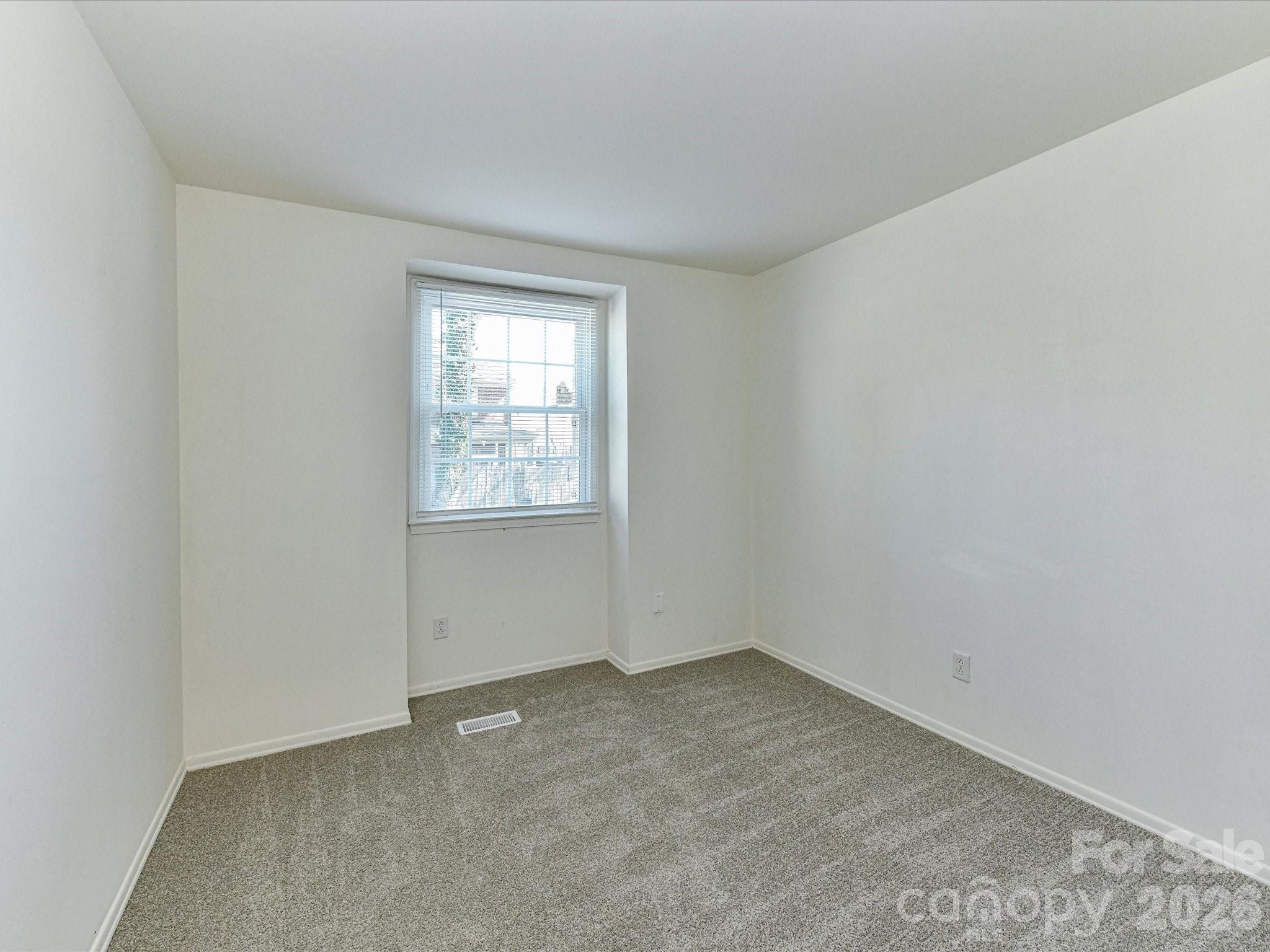 8322 Knights Bridge Road Charlotte, NC 28210 - Photo 29 of 37 an empty room with a window