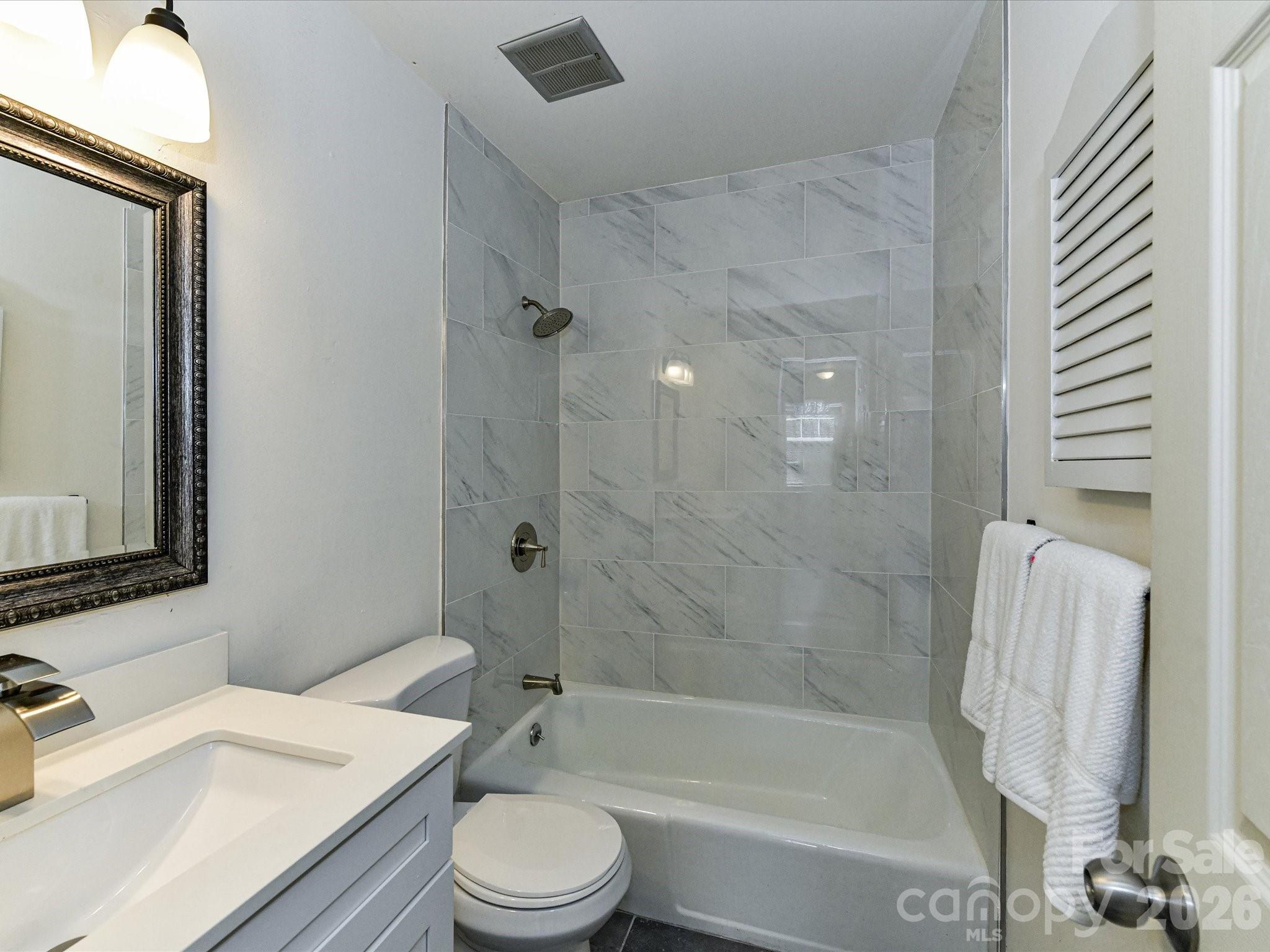 8322 Knights Bridge Road Charlotte, NC 28210 - Photo 31 of 37 a bathroom with a sink toilet and shower