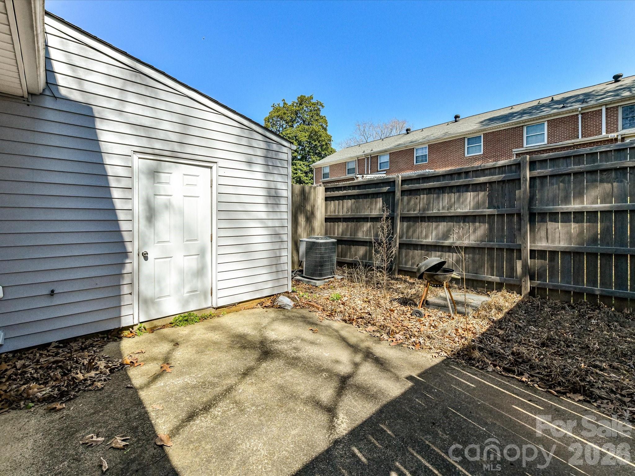 8322 Knights Bridge Road Charlotte, NC 28210 - Photo 34 of 37 a view of a house with a patio