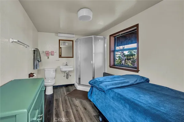 a bedroom with a bed and a view of bathroom