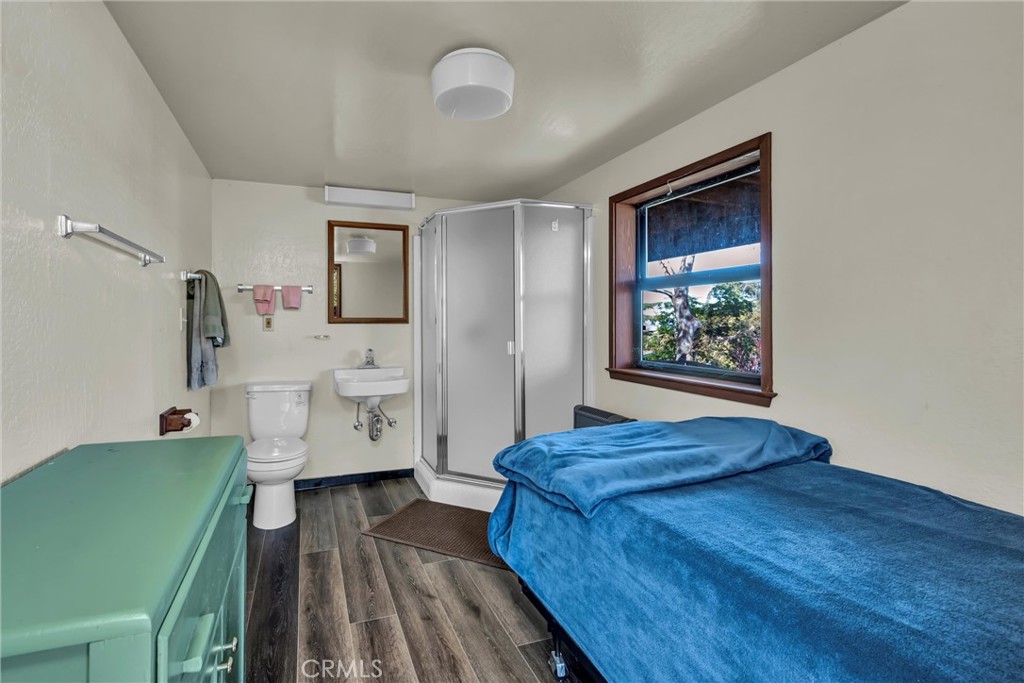 12800 Anderson Road Lower Lake, CA 95457 - Photo 11 of 20 a bedroom with a bed and a view of bathroom