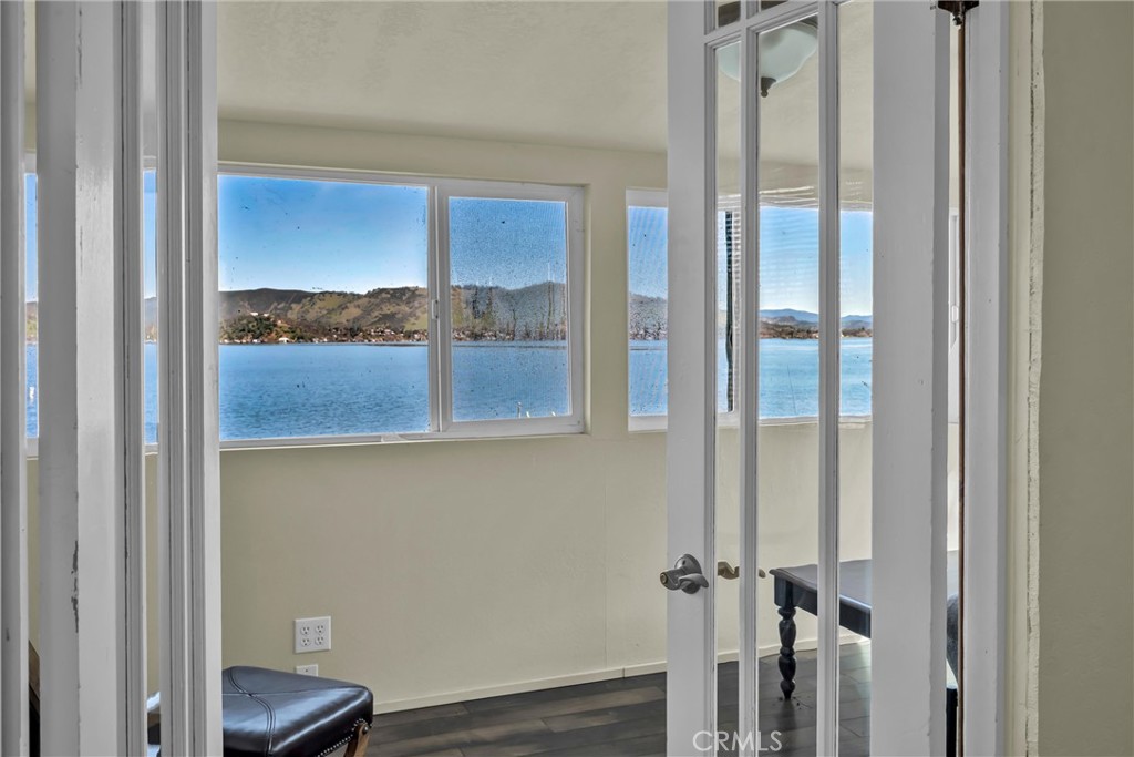 12800 Anderson Road Lower Lake, CA 95457 - Photo 16 of 20 a view of a room that has a large window and wooden floor