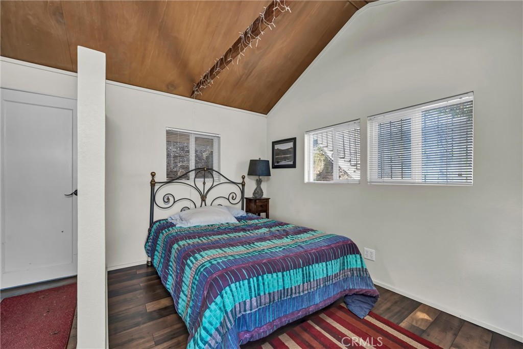 12800 Anderson Road Lower Lake, CA 95457 - Photo 18 of 20 a bedroom with a bed and wooden floor