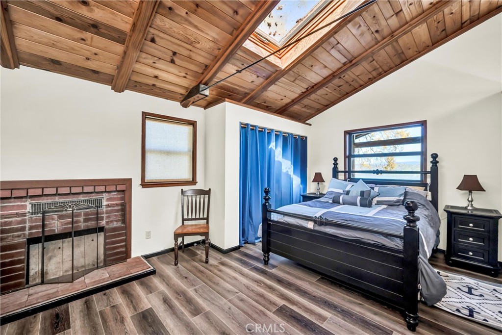 12800 Anderson Road Lower Lake, CA 95457 - Photo 8 of 20 a bedroom with bed and wooden floors