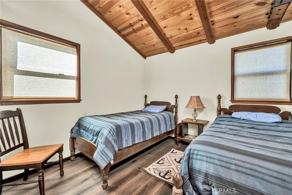 12800 Anderson Road Lower Lake, CA 95457 - Photo 9 of 20 a bedroom with beds and a window