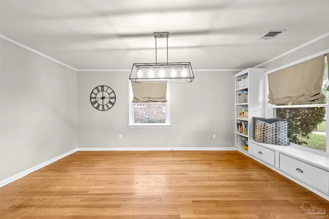 a kitchen with granite countertop a sink stainless steel appliances and cabinets