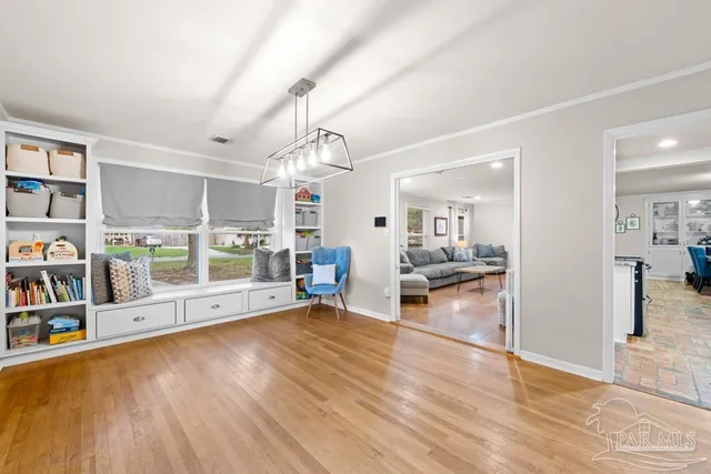 a view of a room with window and wooden floor