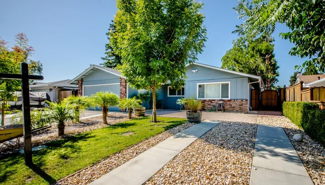 front view of a house with a yard
