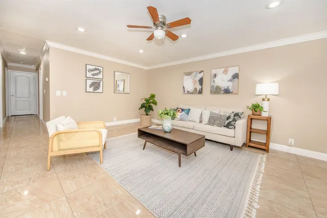 a living room with furniture and a lamp