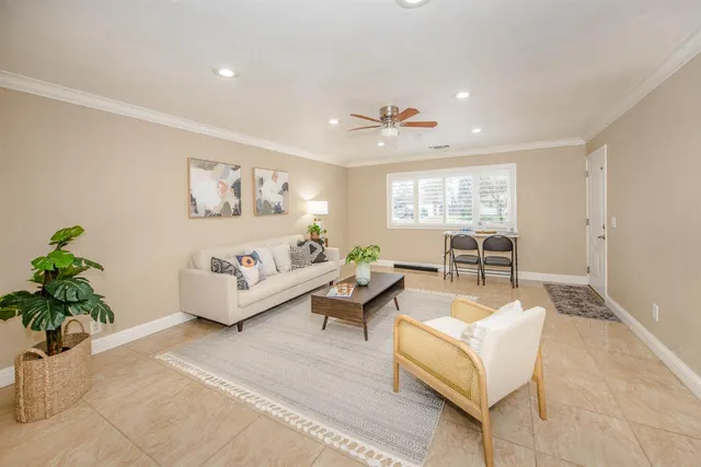 a kitchen with stainless steel appliances granite countertop a sink a stove cabinets and a counter top space