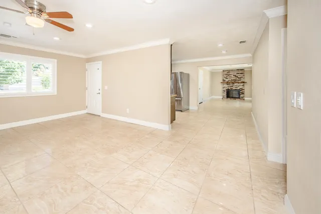 an empty room with windows and natural light