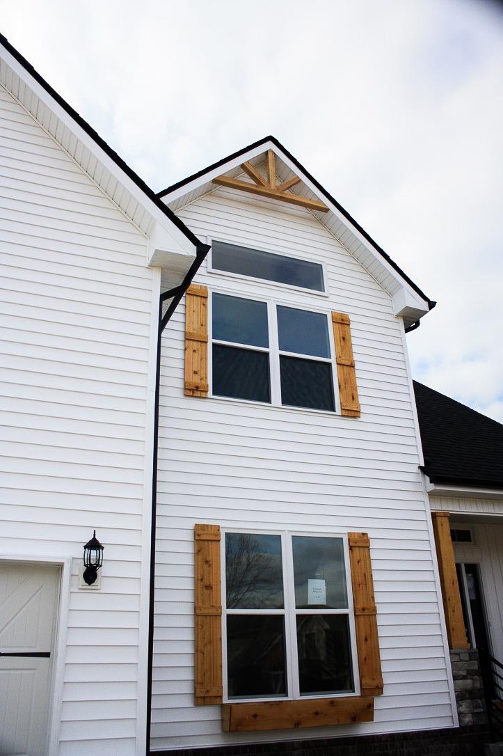 82 South Ridge Clarksville, TN 37043 - Photo 3 of 23 Shutters, Beams at the top, Planter Box. Just enough to really make the outside of this home POP!