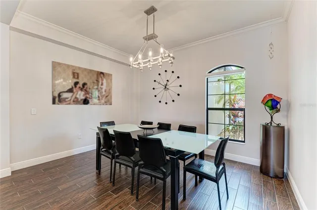 a kitchen with stainless steel appliances granite countertop a sink a oven and a wooden floors