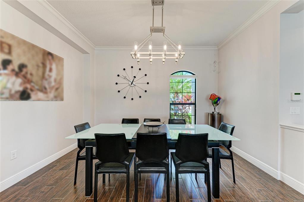 544 Fore Drive Bradenton, FL 34208 - Photo 13 of 95 a view of a dining room with furniture window and wooden floor