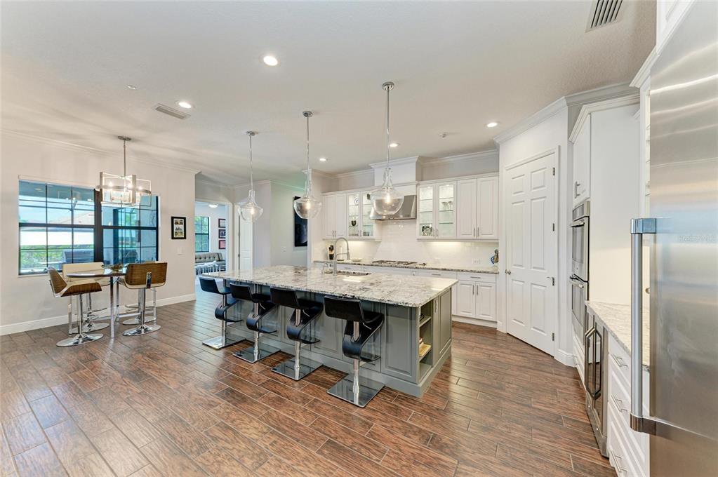 544 Fore Drive Bradenton, FL 34208 - Photo 15 of 95 a large kitchen with a table and chairs