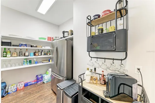 a spacious bedroom with a bed and a dresser