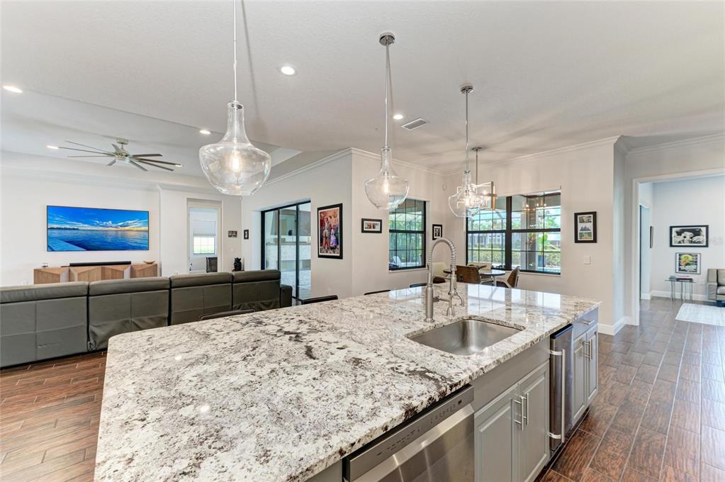 544 Fore Drive Bradenton, FL 34208 - Photo 20 of 95 a kitchen with stainless steel appliances granite countertop a sink a oven and a wooden floors