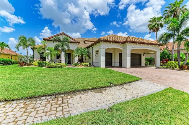 an aerial view of a house with a lake view