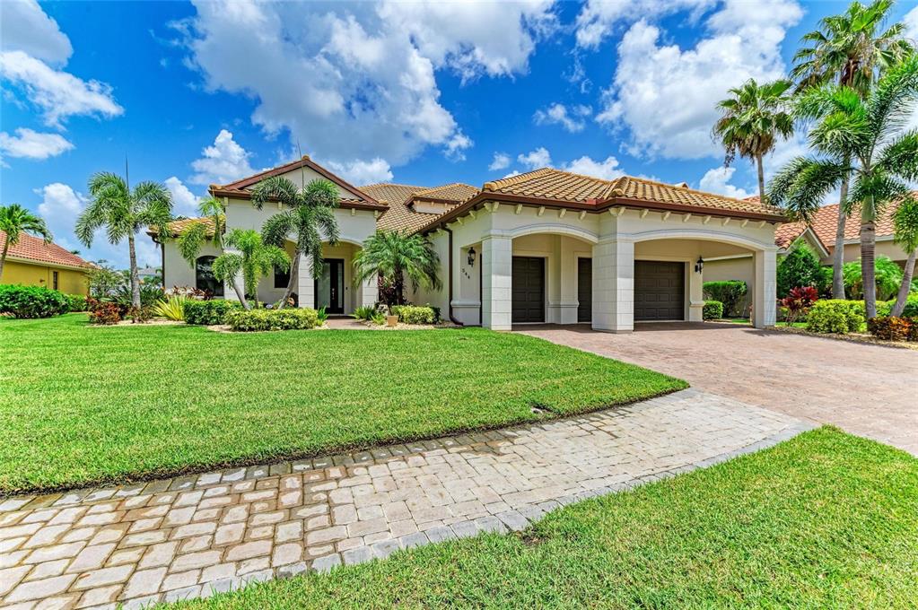 544 Fore Drive Bradenton, FL 34208 - Photo 2 of 95 a front view of a house with a garden